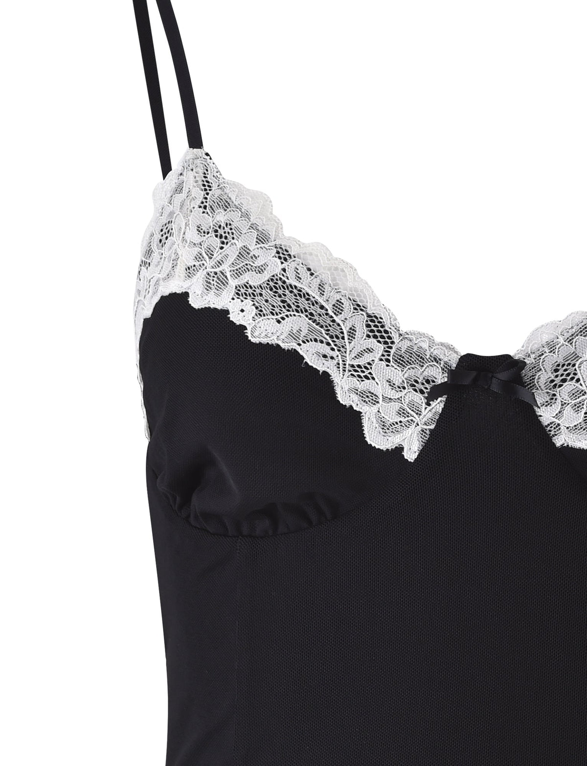 Close-up of the TIGERMIST LEYLA TOP - BLACK lingerie top, featuring delicate, scalloped white lace trim along the neckline. The feminine and elegant design is complemented by thin black shoulder straps.
