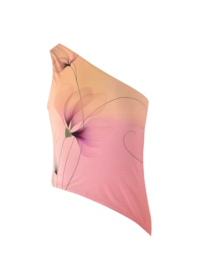 The DREW TOP - MULTI: MACRO FLORAL: GRADIENT FLORAL from TIGERMIST is a stylish one-shoulder top that features a warm color gradient, transitioning from beige at the top to pink at the bottom. The top is adorned with an abstract floral design composed of delicate, curved lines and petals in various shades of pink and orange.