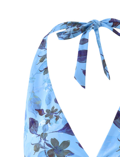 Close-up of the back of the STACI Bikini Top - Blue : Watercolour by TIGERMIST, highlighting the tie closure at the neck. The fabric showcases an array of blue and purple flowers with green leaves against a plain white background.