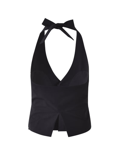The TRISTAN VEST - BLACK from TIGERMIST boasts a deep V-neckline, a bow tie at the neck, and a center slit at the hem. Its design showcases broad straps and a fitted silhouette, offering both style and elegance.