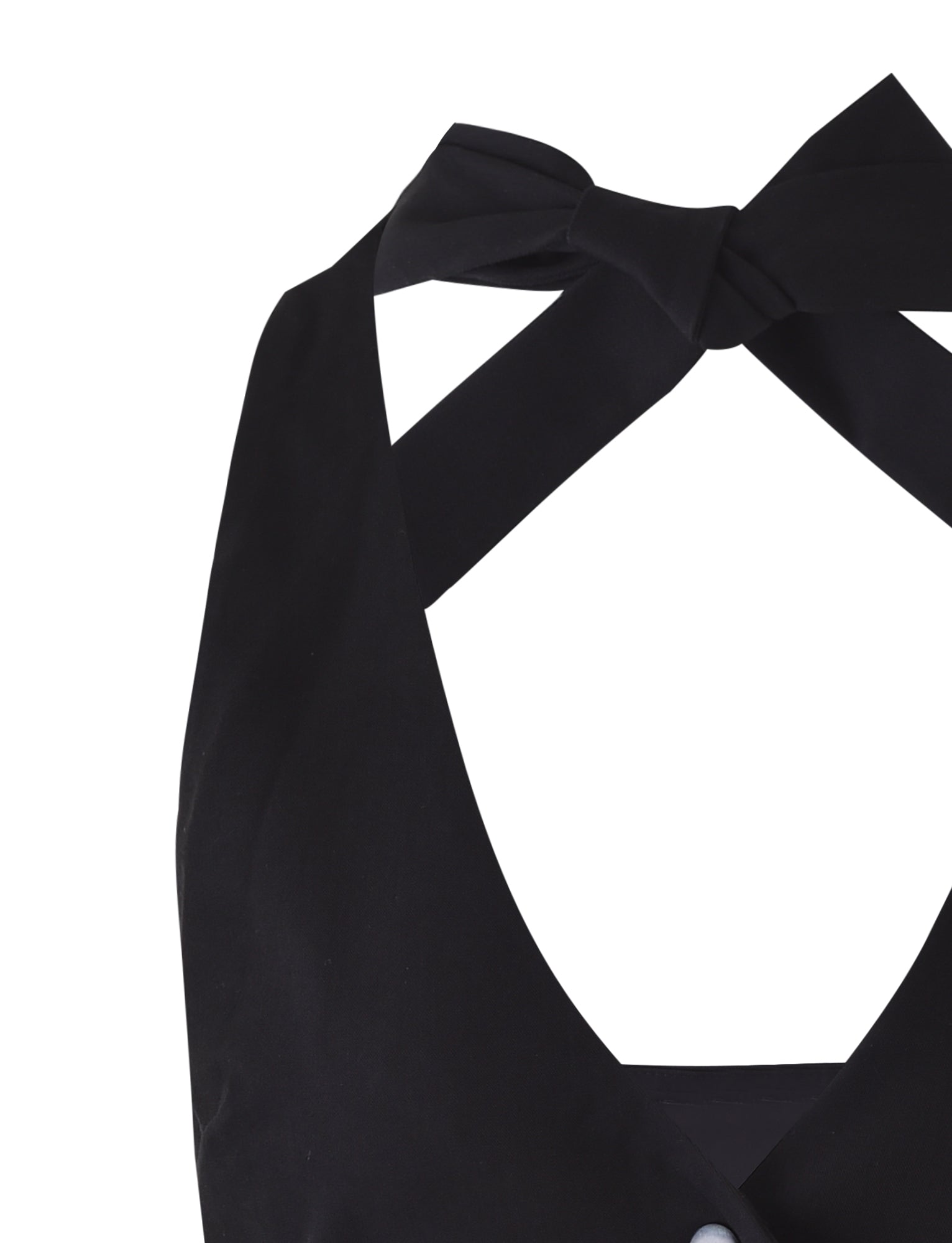 Close-up of the TIGERMIST TRISTAN VEST in black, showcasing its smooth fabric and halter top design with a bow detail at the neckline. The design also features a deep V-cut, with only the upper part of the vest visible against a plain white background.