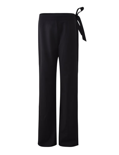 The TRISTAN PANT - BLACK by TIGERMIST features a sleek, satin finish with a side tie detail at the waist, showcasing a clean, minimalist design and an elegant, flowy silhouette.