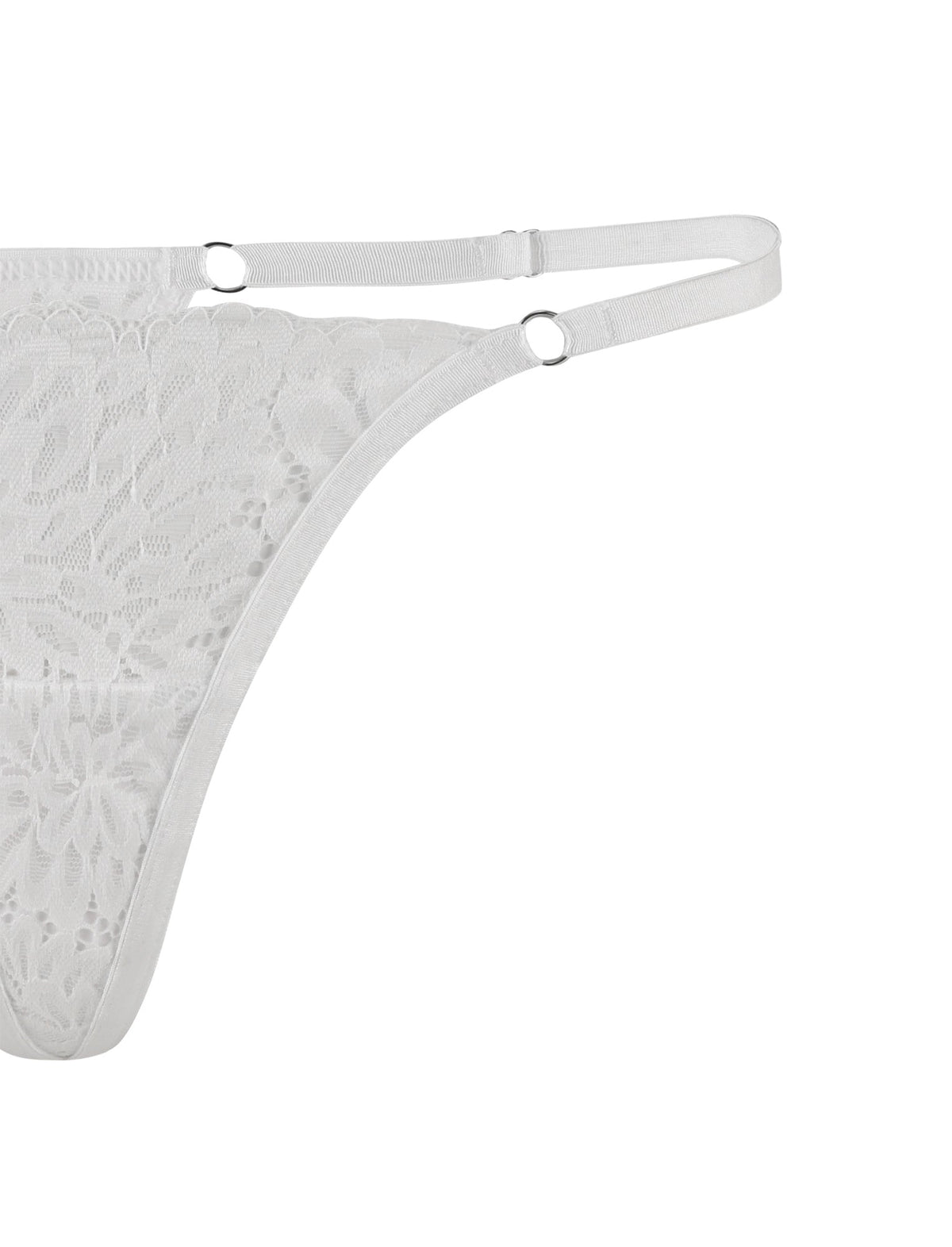 Close-up of the BROOKE SET - WHITE by TIGERMIST, showcasing a white lace thong with dual waistband straps and small, silver ring details. The sheer lace fabric features a floral pattern, and the straps are adjustable for a customized fit. The image primarily focuses on the side view of the thong.