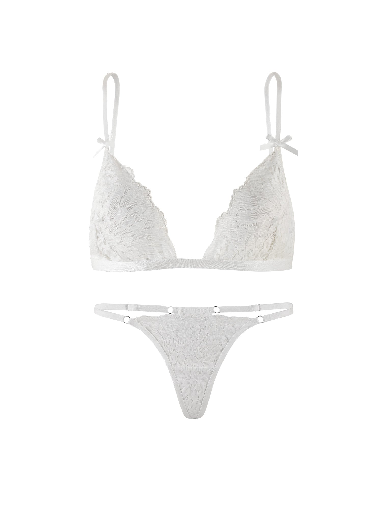 A delicate intimate set from TIGERMIST, the BROOKE SET - WHITE features a sheer lace bralette with adjustable shoulder straps and matching lace panties. The bralette is adorned with a floral design, while the panties include side straps with small metal rings connecting to the lace portion.