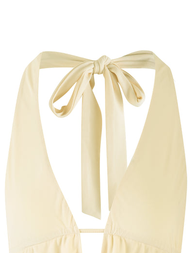 Close-up view of the back of the PEARL TOP - YELLOW : PALE LEMON : BUTTER bikini from TIGERMIST. The straps are tied into a bow at the neck, highlighting the simple and elegant design of the swimwear. The fabric appears smooth and lightweight.