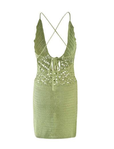 Introducing the ISABELL DRESS - GREEN : PASTEL GREEN from TIGERMIST. This sleeveless crochet dress in a soft pastel green features a deep V-neckline and stylish cross-back straps. It boasts a delicate, lacy upper bodice complete with a charming crisscross tie at the front, smoothly transitioning to a more tightly knit pattern on the skirt.