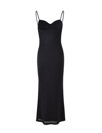A sleek, black Catya Dress by TIGERMIST is displayed against a white background. This form-fitting evening dress boasts a subtle shimmer and features spaghetti straps, a sweetheart neckline, and a long, straight silhouette that extends to the ankles.