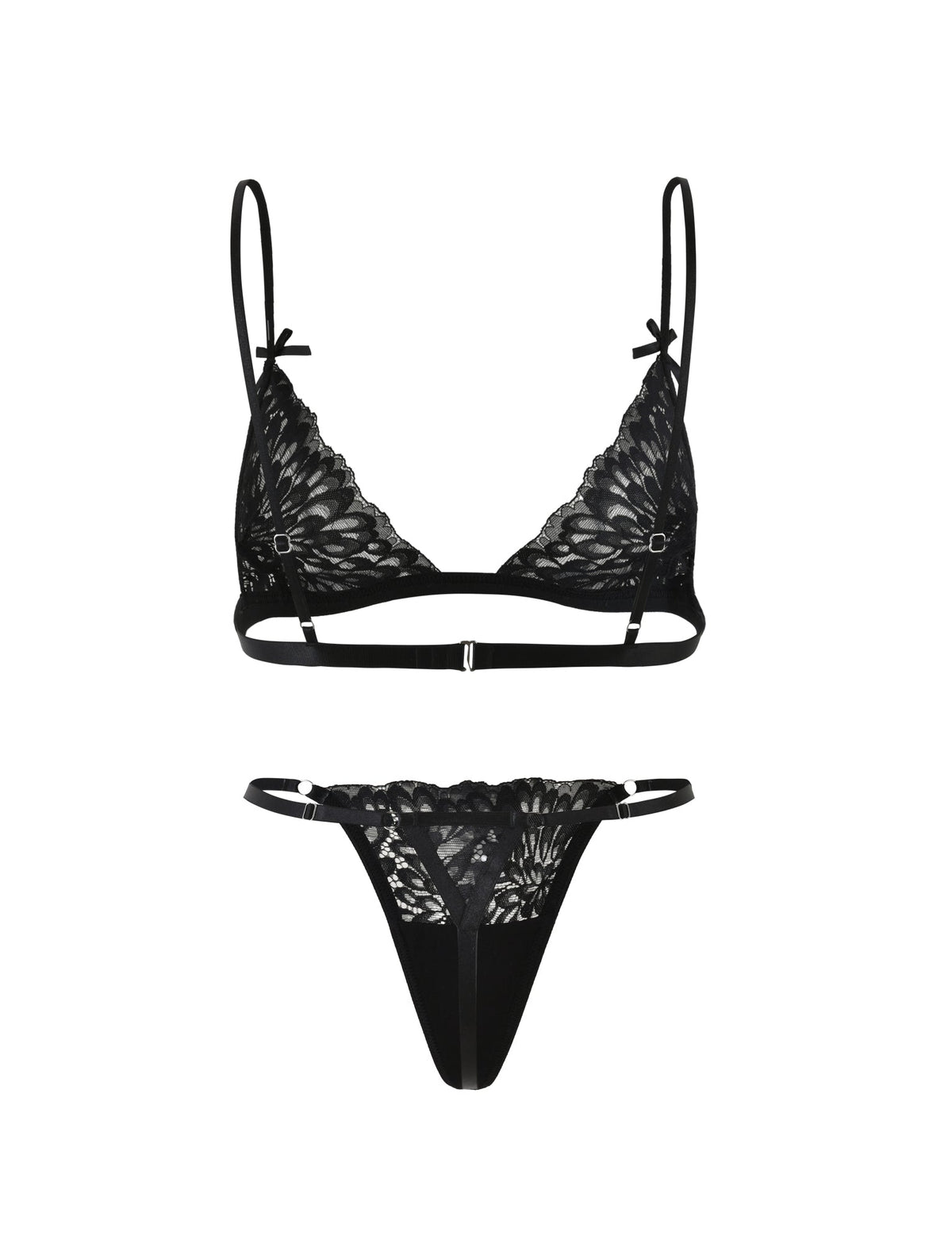 The BROOKE SET - BLACK from TIGERMIST is a black lace lingerie set that includes a bra and matching thong. The bra boasts delicate floral lace patterns, thin adjustable straps, and small decorative bows on the straps. The thong features a lace front with a thin elastic waistband.