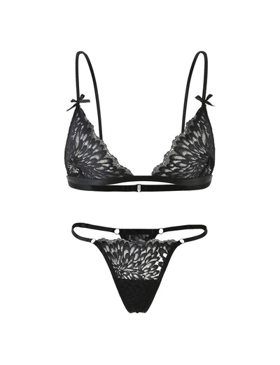 Introducing the BROOKE SET - BLACK by TIGERMIST, a stunning black lace lingerie ensemble. This set includes a bralette with adjustable straps and delicate sheer floral lace detail, adorned with small bow accents at the straps. The matching thong features the same elegant sheer lace pattern with thin elastic sides, exuding both elegance and allure.