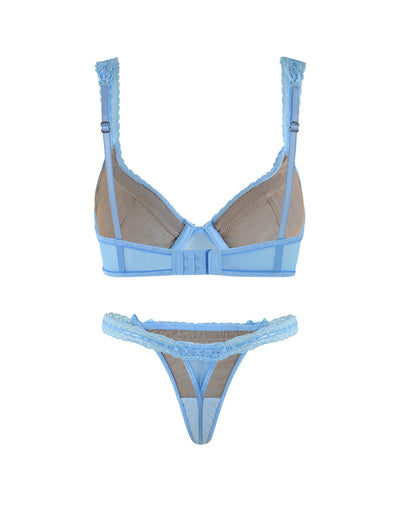 The PANDORA SET - BLUE by TIGERMIST is a stunning light blue lingerie ensemble that includes a bra and thong, both crafted with delicate blue lace and sheer mesh fabric. The bra features adjustable straps and a hook-and-eye closure at the back, while the thong showcases intricate lace detailing and a thin waistband.