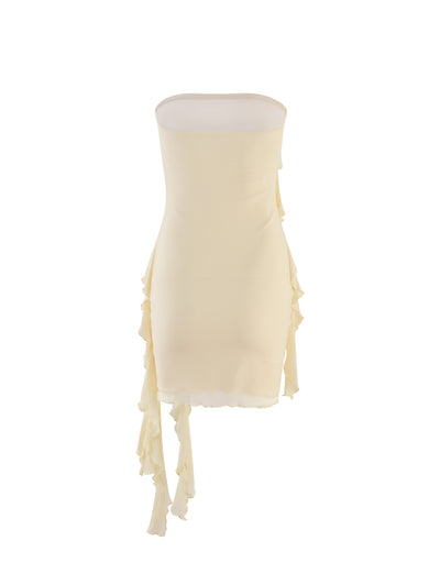 A strapless, form-fitting dress from TIGERMIST in a butter yellow hue. The SADIA DRESS features ruffled, asymmetrical fabric panels cascading down the sides, adding texture and movement to its sleek silhouette.