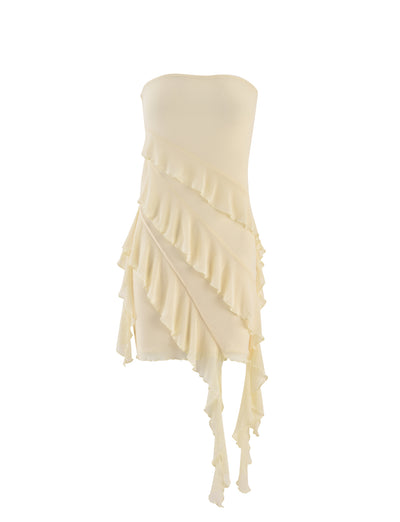 The SADIA DRESS - YELLOW : BUTTER by TIGERMIST features a strapless design and cascading ruffles that flow diagonally across the body. The asymmetrical ruffles create a dynamic, layered look, while the dress maintains a slim, form-fitting silhouette for an eye-catching visual element.