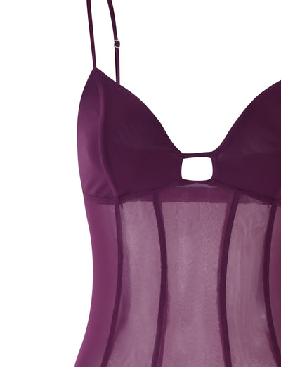 Close-up of the Tiger Mist KAIDA DRESS in purple, plum, or aubergine. The garment includes thin adjustable shoulder straps and a small cut-out detail at the center of the bust. The material is sheer with vertical seams for structure and fit.