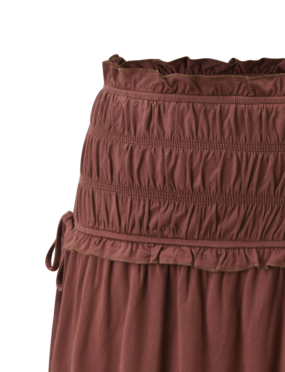 Close-up of the TIGERMIST DENALI MINI SKIRT - CHOCOLATE, featuring a wide smocked waistband, gathered buttery jersey fabric with a textured ruched design, and a small side tie detail.