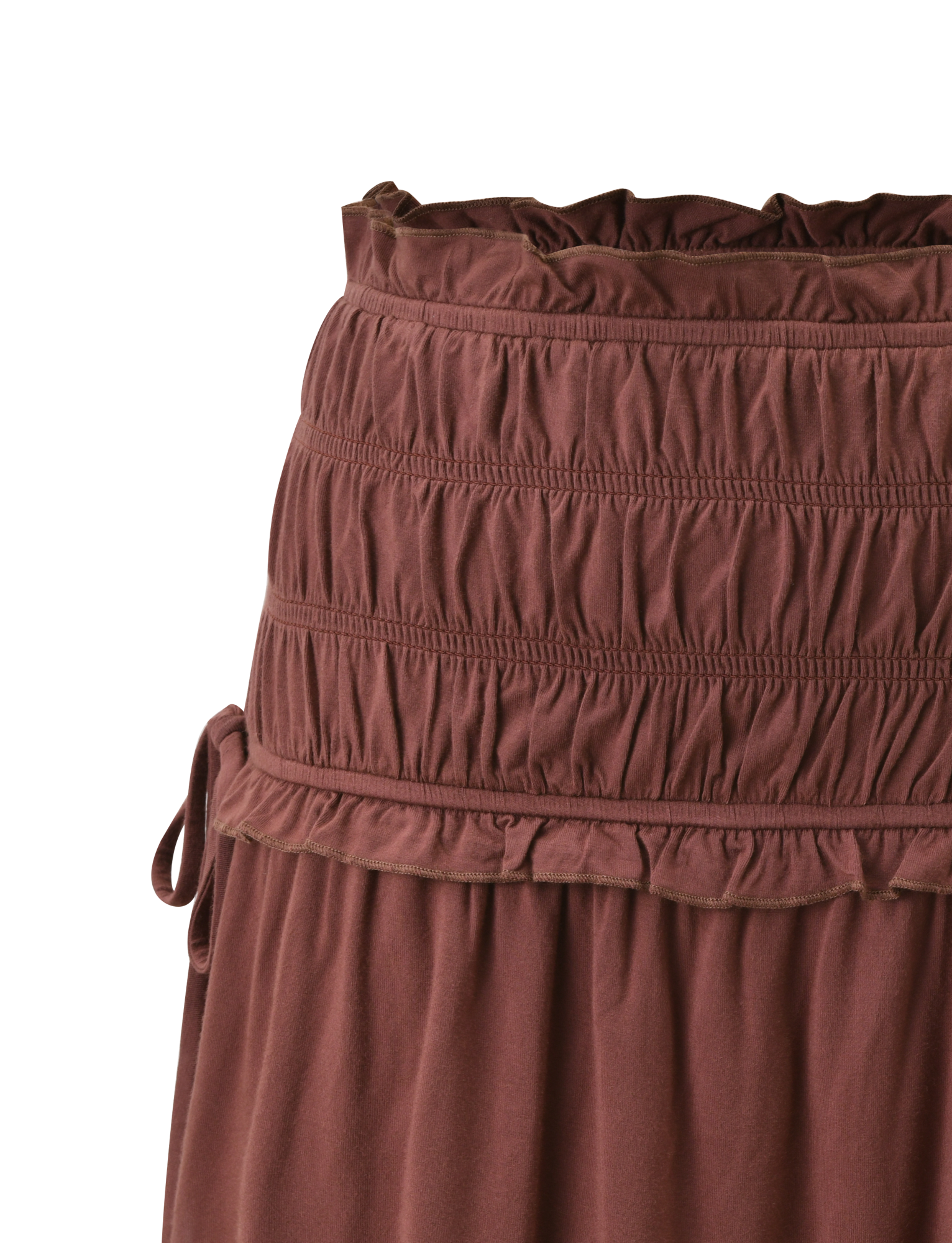 Close-up of the TIGERMIST DENALI MINI SKIRT - CHOCOLATE, featuring a wide smocked waistband, gathered buttery jersey fabric with a textured ruched design, and a small side tie detail.
