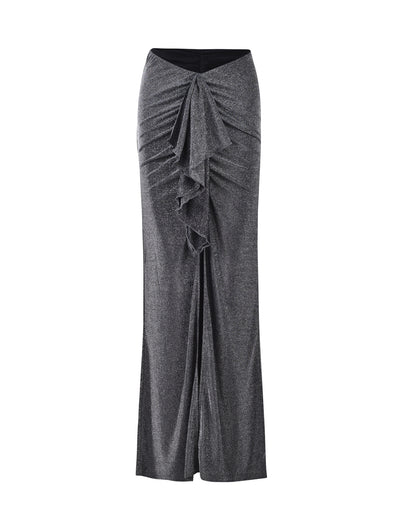 The DAISIE SKIRT by TIGERMIST is a high-waisted black shimmer skirt that features a ruffled design down the center front, adding texture and elegance. It flares slightly at the hem, creating a sophisticated silhouette with its soft and flowy fabric.