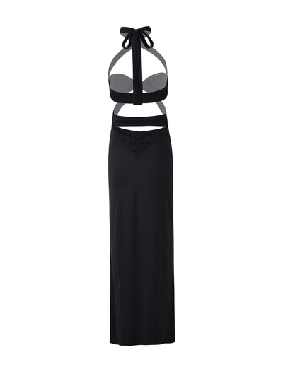 Introducing the TAMSIN MAXI DRESS - BLACK from TIGERMIST, a sleek black sleeveless halter-neck creation featuring cut-out sections at the waist and a fitted long skirt. The minimalist design is completed with a tied bow at the neck, exuding modern elegance.