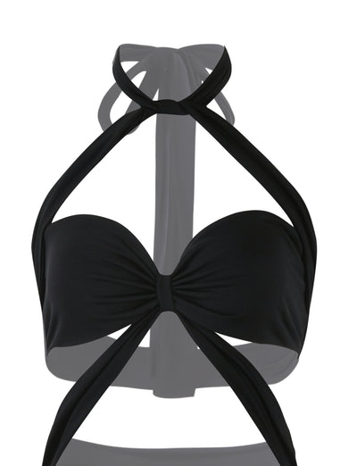 The TAMSIN MAXI DRESS in black from TigerMist boasts a unique design with twisted straps. It features a wrapped effect at the front that forms an X shape and ties around both the neck and back. The smooth, stretchy material offers a stylish and contemporary look.