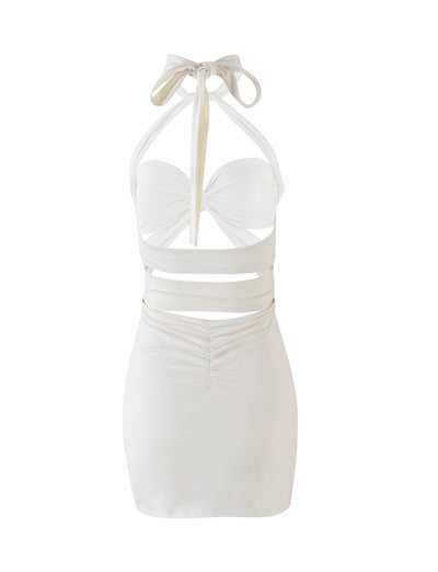 Introducing the TAMSIN MINI DRESS in Off White by TIGERMIST: a stunning mini dress featuring a halter neck and edgy cut-out detailing at the front and sides. It showcases a ruched design on the lower back and an elegant, chic backless style, with ties at the neck and back to complete the look.