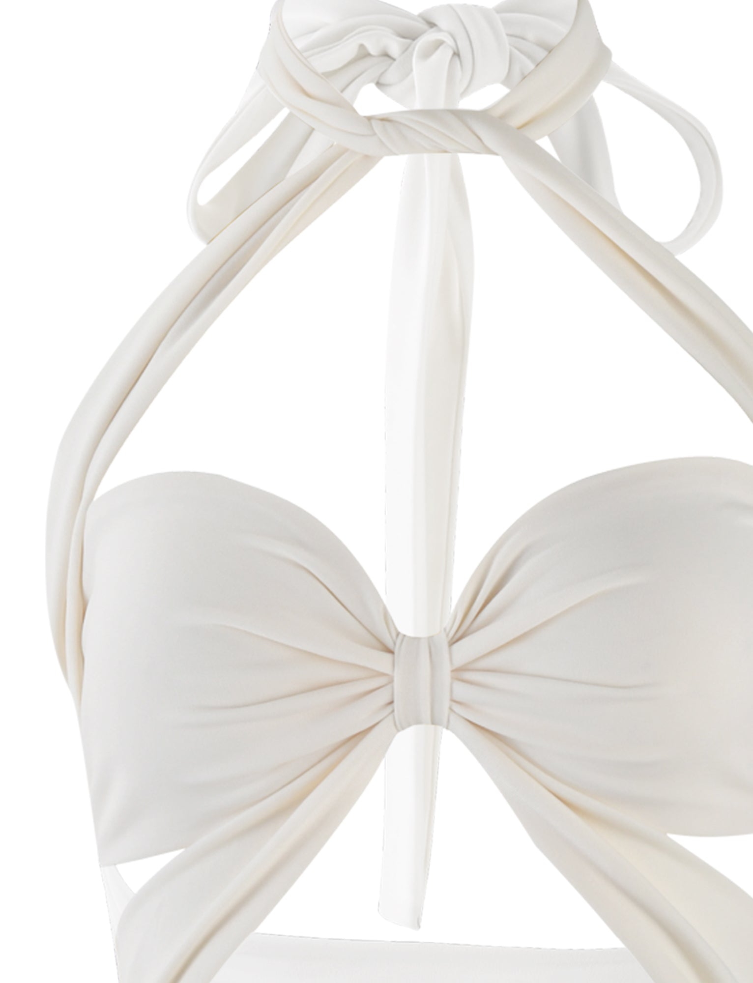Close-up of a white Tiger Mist Tamsin Mini Dress. The dress features a twisted front design forming a bow-like shape at the center, with halter straps tied at the neck. The material appears smooth and slightly glossy.