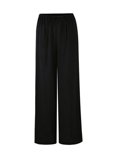 A pair of LAINEY PANTS in black from the TIGERMIST brand. These wide-leg pants are crafted from a lightweight fabric and feature an elastic waistband for ultimate comfort and ease of wear. With a simple, clean design devoid of visible pockets or embellishments, these trousers are perfect for various casual or semi-formal occasions.