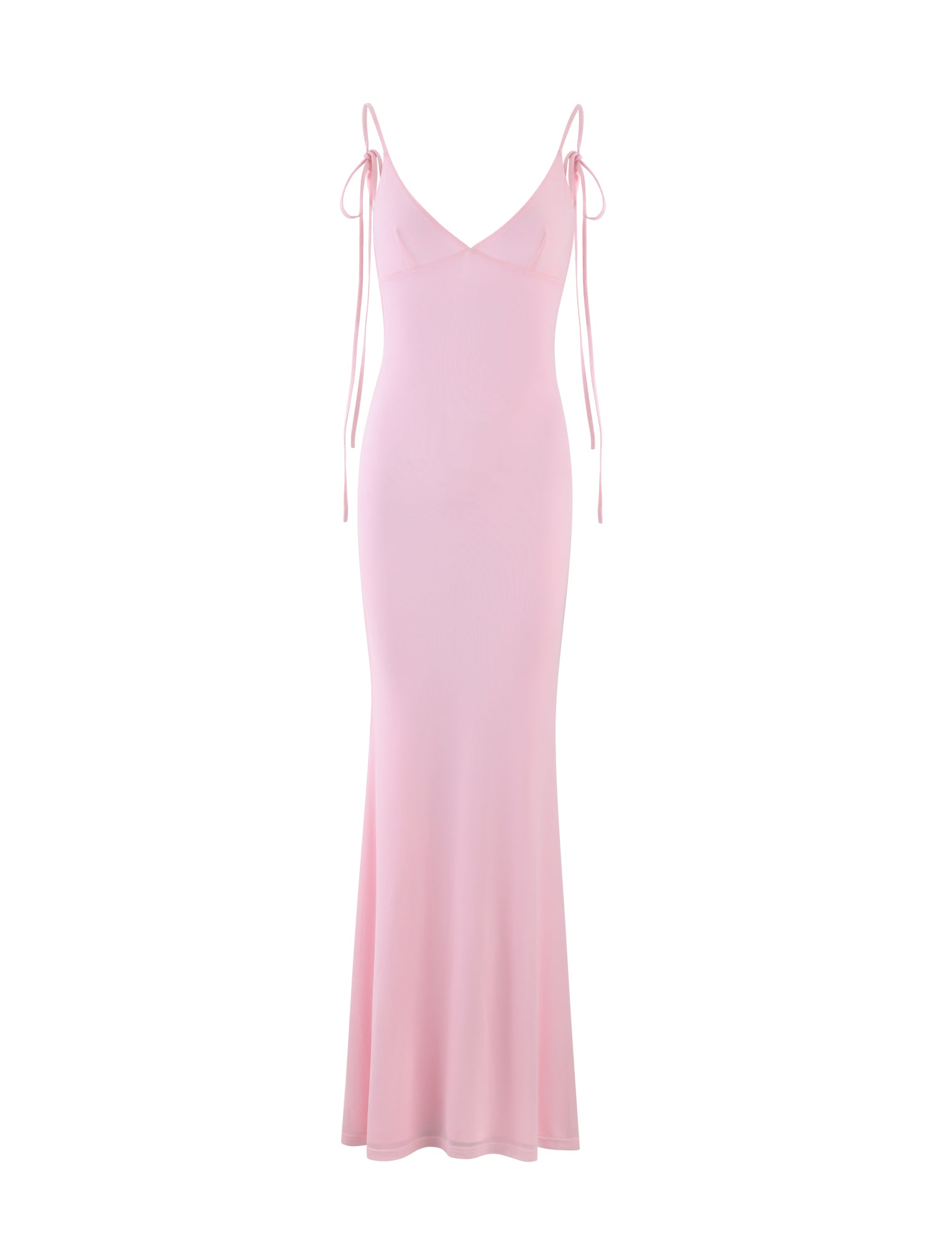 The KYLAH DRESS - PINK : BABY PINK from TIGERMIST is a full-length pink dress with a fitted silhouette, featuring thin spaghetti straps and a deep V-neckline. It includes additional ties that drape off the shoulders, adding a delicate touch. Its smooth, flowing fabric flares slightly at the hem.