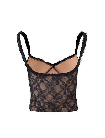 The DEJA TOP - BLACK : LACE by TIGERMIST is a cropped camisole featuring thin straps, a crisscross back design, and a nude lining. The black lace fabric is adorned with a floral pattern. The garment is displayed on a white background.