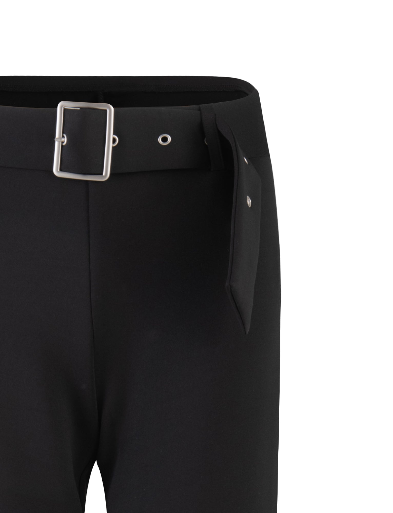 Close-up of the HADLEY PANT - BLACK by TIGERMIST featuring a high-waisted design. The pants have a wide belt with a rectangular metal buckle and multiple metal eyelets for adjustment. The fabric appears smooth and slightly structured. The background is plain white.