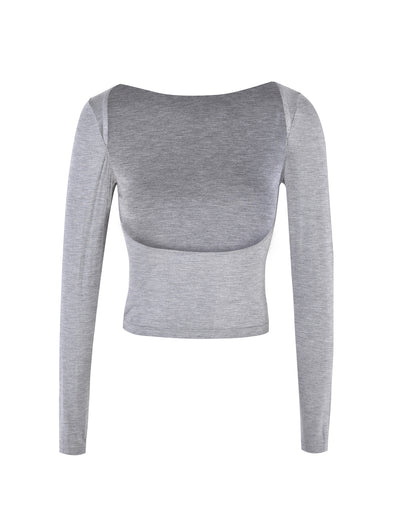The QUINNELL TOP - GREY by TIGERMIST is a gray, long-sleeve crop top featuring a boat neckline. The front view reveals a soft, slightly stretchy fabric that offers a fitted silhouette.