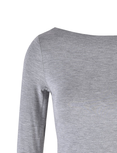 A close-up view of the TIGERMIST QUINNELL TOP in grey. The image captures the shoulder, sleeve, and upper torso of the garment, showcasing its smooth fabric texture and simple, minimalist design. The material appears to be soft and comfortable.