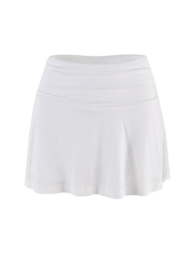 The VERITY SKORT - WHITE by TIGERMIST is a plain white, high-waisted A-line mini skort with a slightly flared hem, blending classic style with a sleek bodycon silhouette and displayed against a white background.