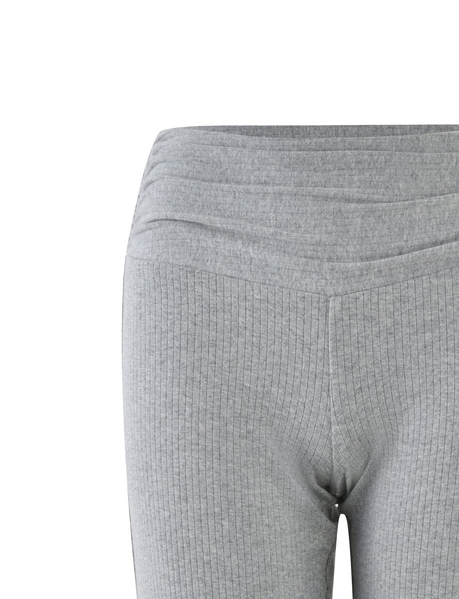 Close-up of the waist and upper thighs of a person wearing KAVAT PANT - GREY (DOVE GREY) high-waisted, ribbed leggings from TIGERMIST. The fabric showcases horizontal and vertical ribbing patterns, while the waist features a layered design with a slightly raised, curved seam across the front.