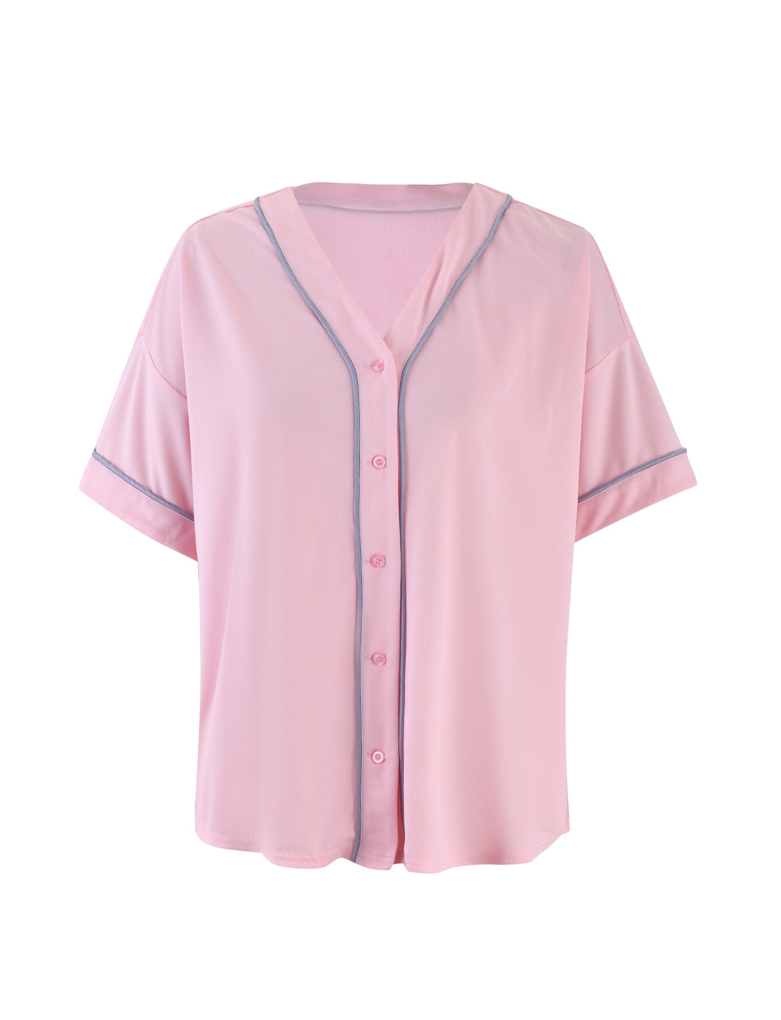 The ZEA TOP - PINK from TIGERMIST is a light pink, short-sleeved button-up shirt with a V-neck and gray piping along the edges. It has a relaxed fit and is displayed against a plain white background.