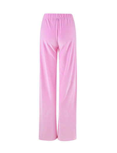 Rear view of the ERICKA PANT - PINK : BABY PINK by TIGERMIST, featuring high-waisted, wide-leg pants made from a soft, light pink fabric. The pants have an elastic waistband and a smooth, flowing texture.