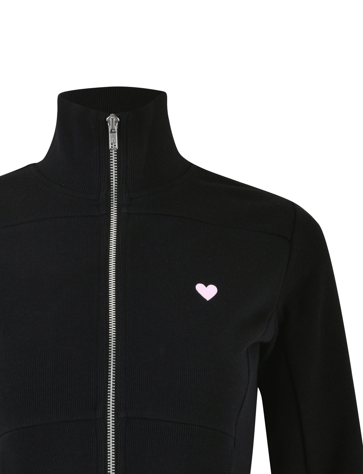 A close-up of the VERDA JACKET - BLACK from TIGERMIST, showcasing its high collar and front zipper. The long-sleeved jacket features a small pink heart logo on the left chest. The image highlights the upper half of the jacket, excluding the head and lower body.
