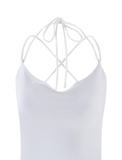 The ZAIDA TOP - WHITE from TIGERMIST features thin, crisscrossing straps and a low-cut back. The smooth, fitted fabric gives the top a minimalist and elegant look.