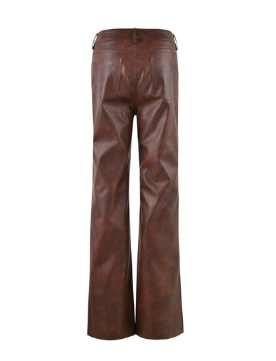 A pair of high-waisted, wide-leg leather WILDER PANTS in a rich red brown color from TIGERMIST, viewed from the back. The pants feature two back pockets with no visible stitching or embellishments, creating a smooth and sleek appearance. The texture appears slightly glossy.