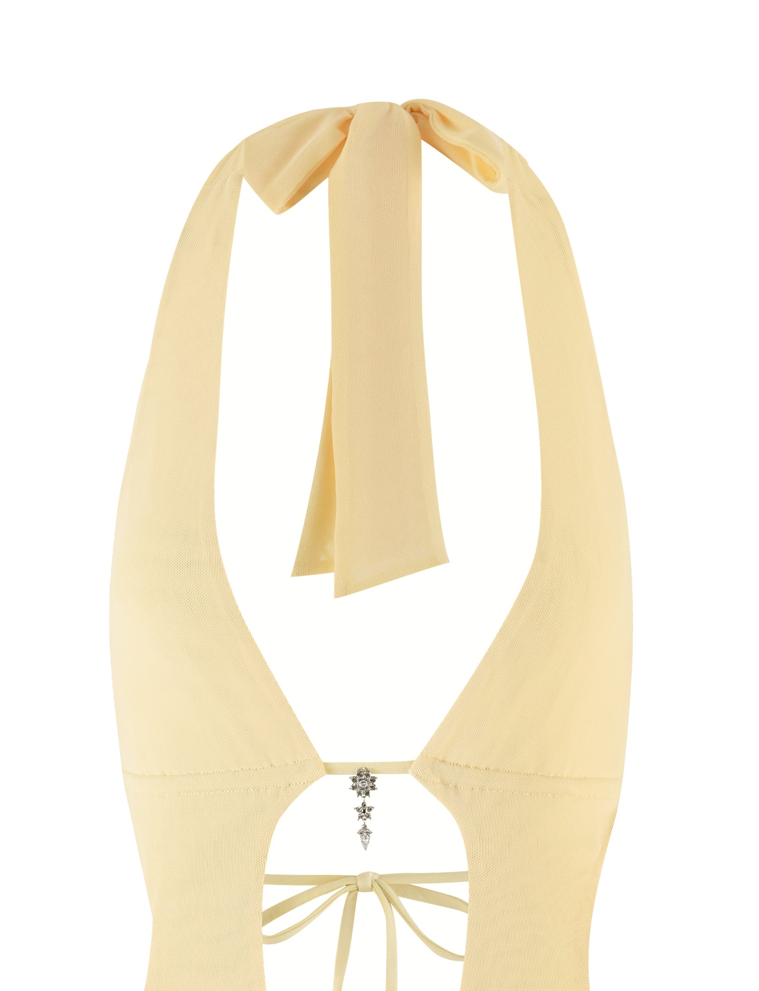 The back view of the ESHA MINI DRESS - YELLOW: LEMON by TIGERMIST showcases a light yellow lemon halter design with a large bow at the neckline. It features an elegant open back with decorative ties and a small star embellishment at the center.