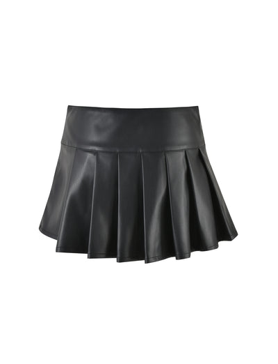 The TIGERMIST MERRI SKIRT - BLACK : BLACK PU is a short pleated black leather skirt that stands out against a white background. It features a wide waistband and evenly spaced pleats that flare out, creating a structured and stylish look.