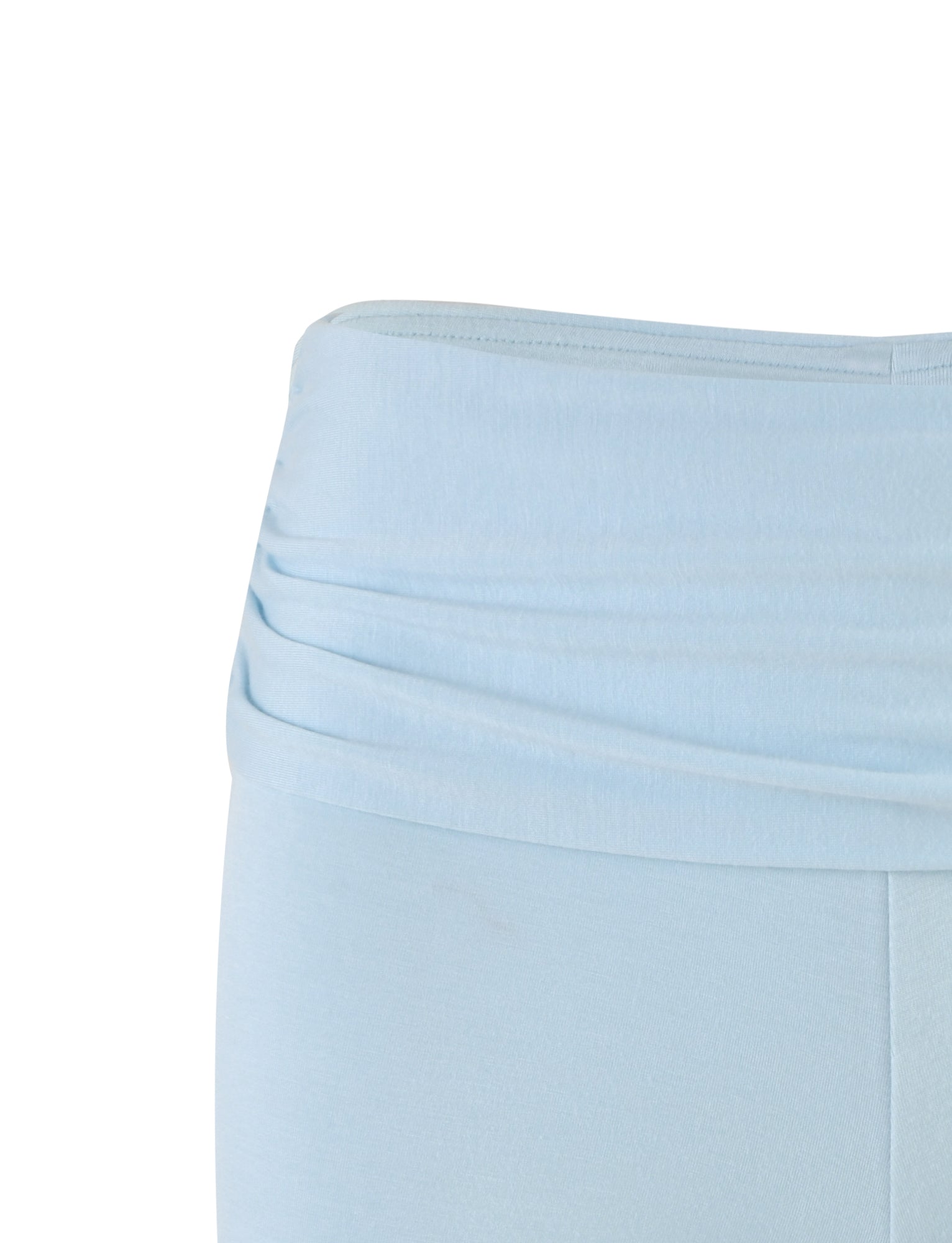 A close-up of the Karina Short in pastel blue from TIGERMIST. The image focuses on the waistband, which features a gathered design, giving a gently ruched appearance. The fabric appears soft and stretchy, suitable for activewear or casual wear.