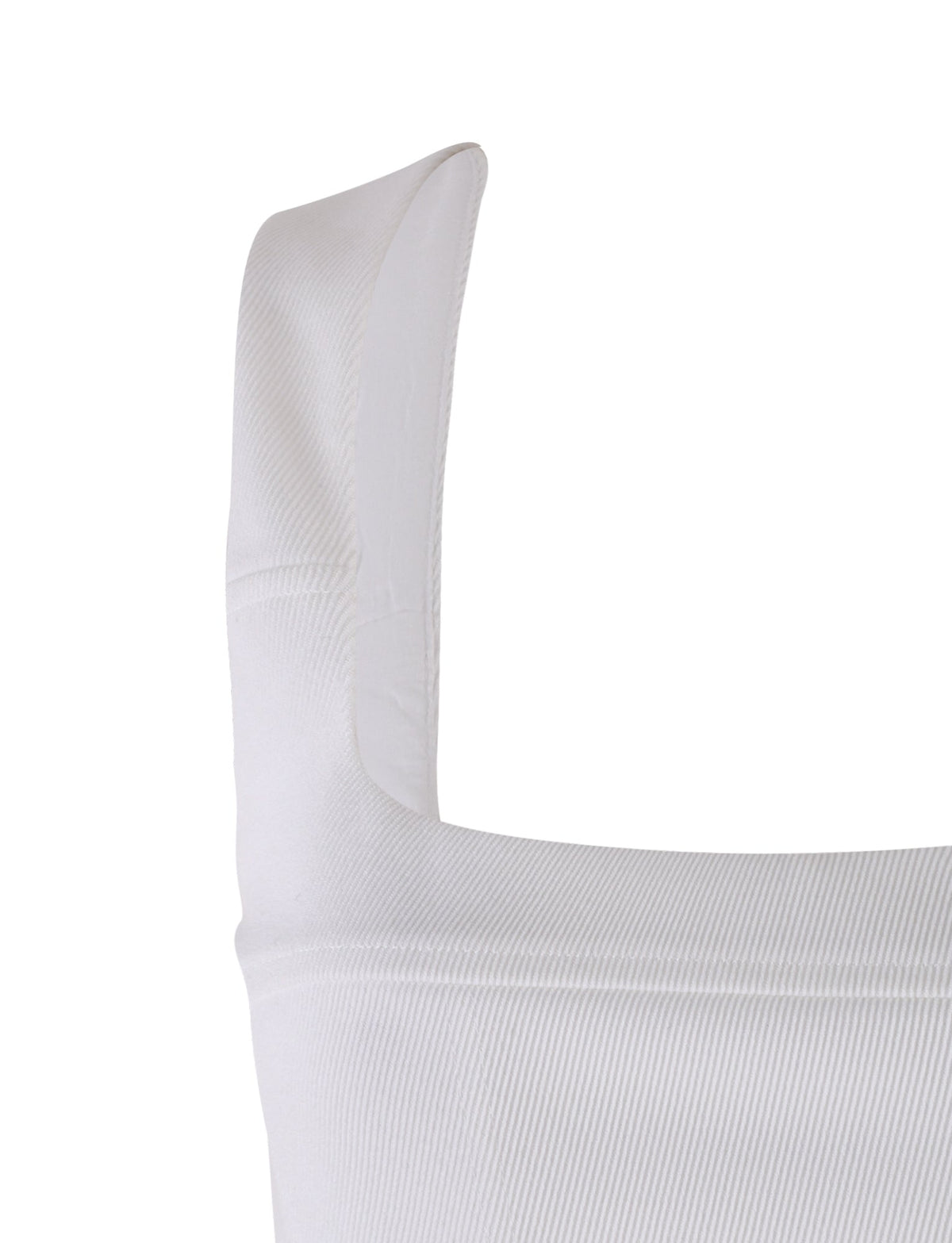 Close-up of the SULLIVAN TOP - WHITE from TIGERMIST, showcasing the broad strap. The texture and stitching of the fabric are visible, suggesting it is part of a top or similar clothing item.