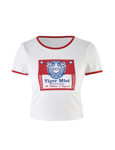 The SIOBHAN T-SHIRT - WHITE by TIGERMIST is a stylish short-sleeve t-shirt featuring red trim on the neckline and sleeves. Its front showcases a prominent blue and red graphic reading "TIGERMIST" along with detailed text, adorned with two tigers and a crest design.