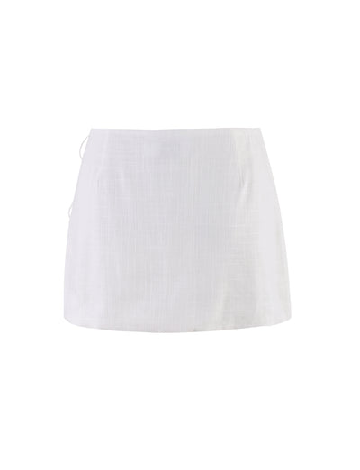 The NICOLA SKIRT - WHITE from TIGERMIST is displayed against a plain white background. Featuring a straight, simple design made of lightweight fabric, it has no visible embellishments or pockets, resulting in a clean, minimalist look.