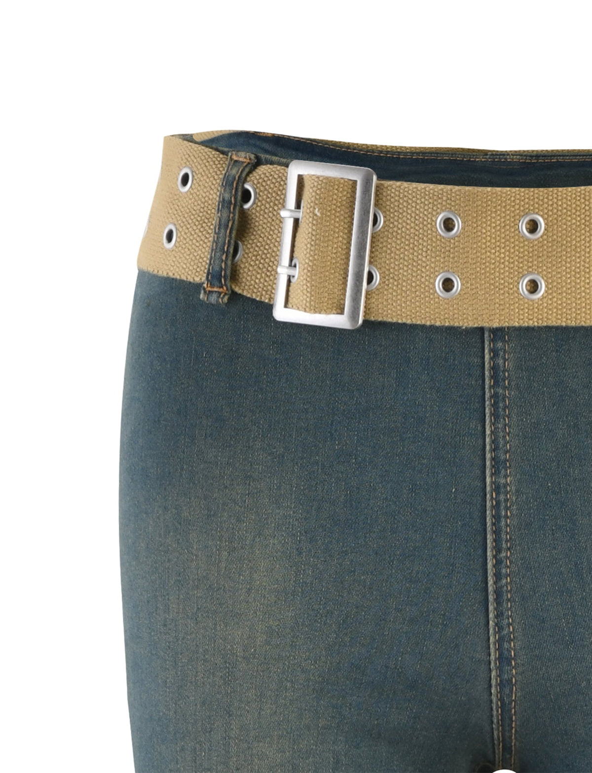 The image shows a close-up of a person's waist wearing ISABEL JEAN - BLUE : DENIM BLUE pants by TIGERMIST, accessorized with a light brown belt from the same brand. The belt features multiple metallic grommet holes and has a large rectangular metal buckle. Only the lower torso is visible.