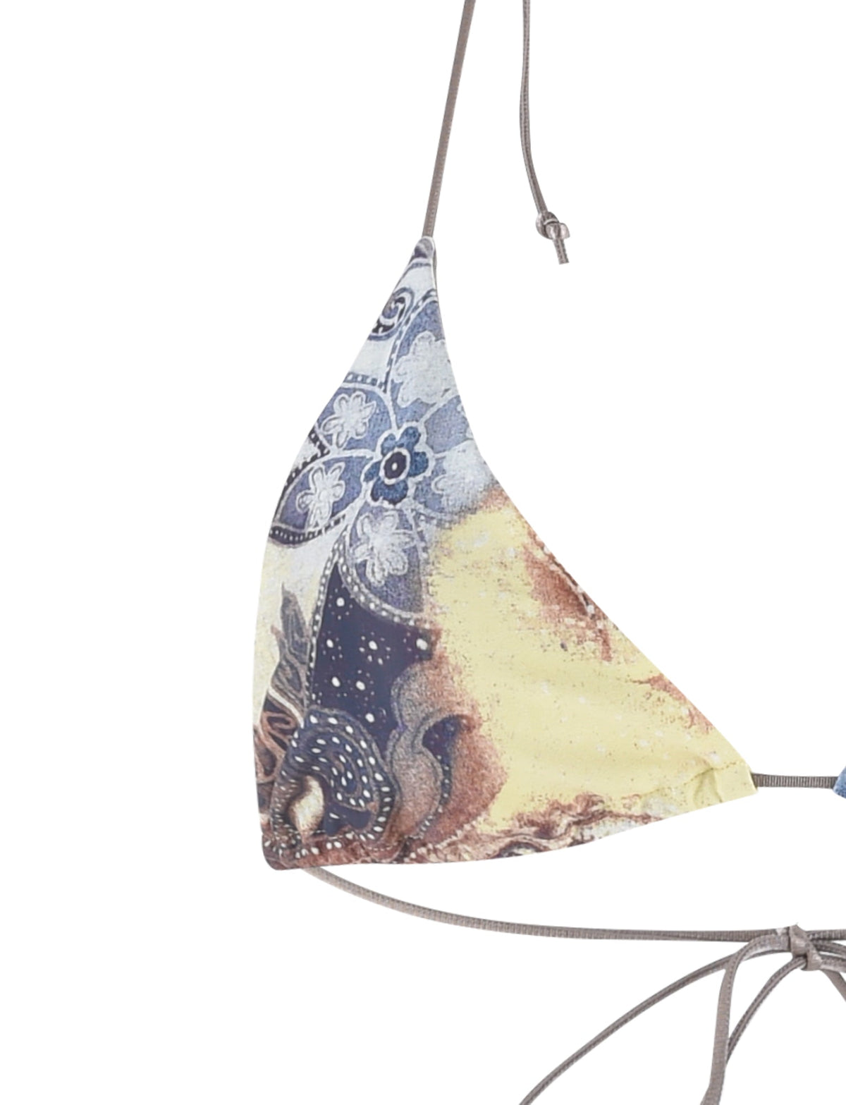 Close-up of a Tiger Mist Kryze Bikini Top showcasing a paisley tie-dye pattern in an array of blue, yellow, and brown shades. The triangular fabric is held together by thin brown straps, one tied at the top and another visible on the side.