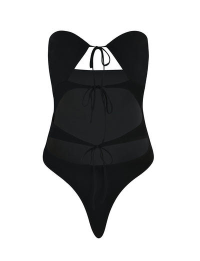Here is your revised sentence incorporating the provided product data:

The KINERA BODYSUIT in black from TIGERMIST features a halter neck tie and cutout details at the front, along with two additional ties below the bust and at the waist, creating a sleek and modern design.