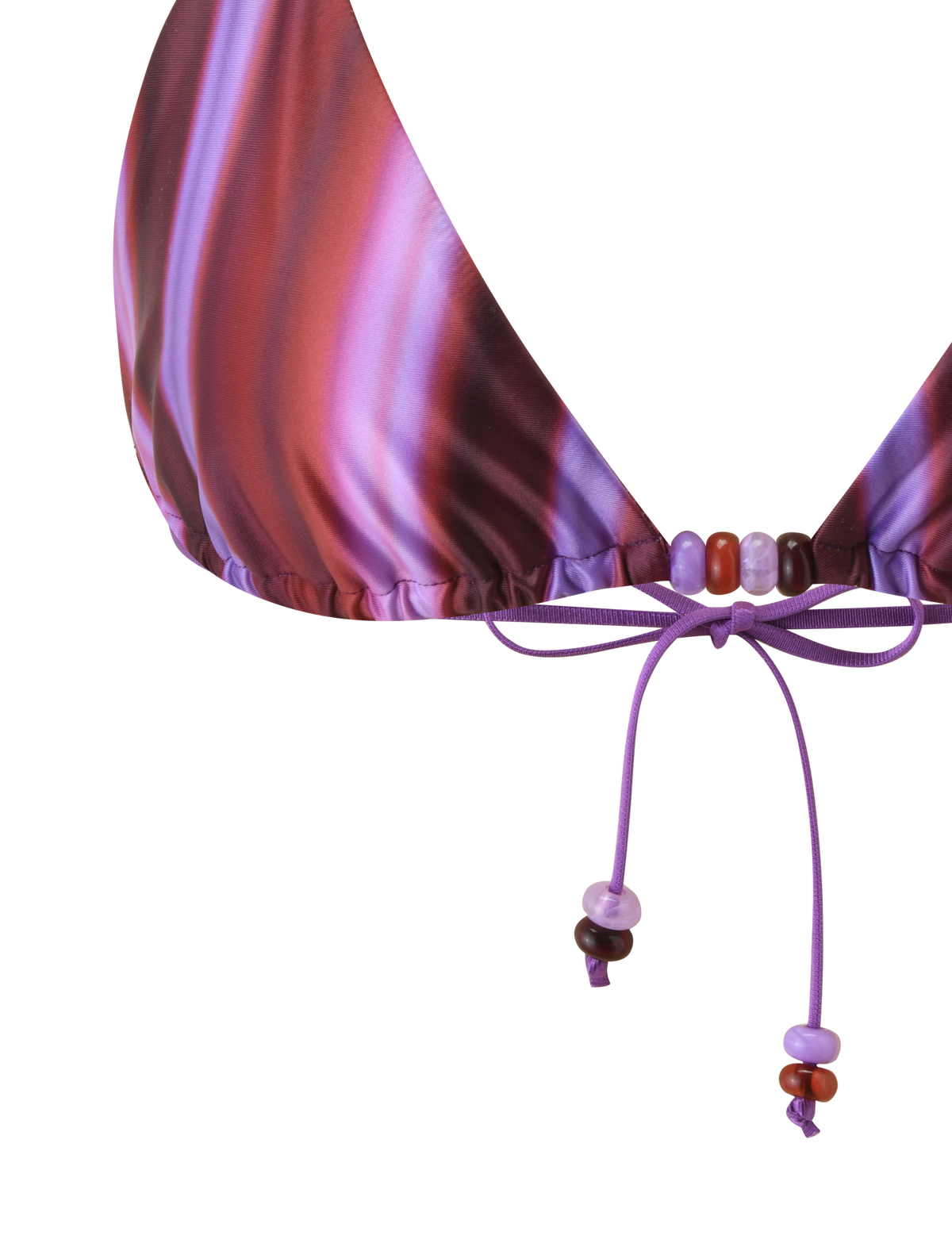 Close-up of the TIGERMIST FINLEA BIKINI TOP - DUSK OMBRE STRIPE, an adjustable triangle top with purple and pink stripes, featuring purple string ties detailed with small purple and red beads.