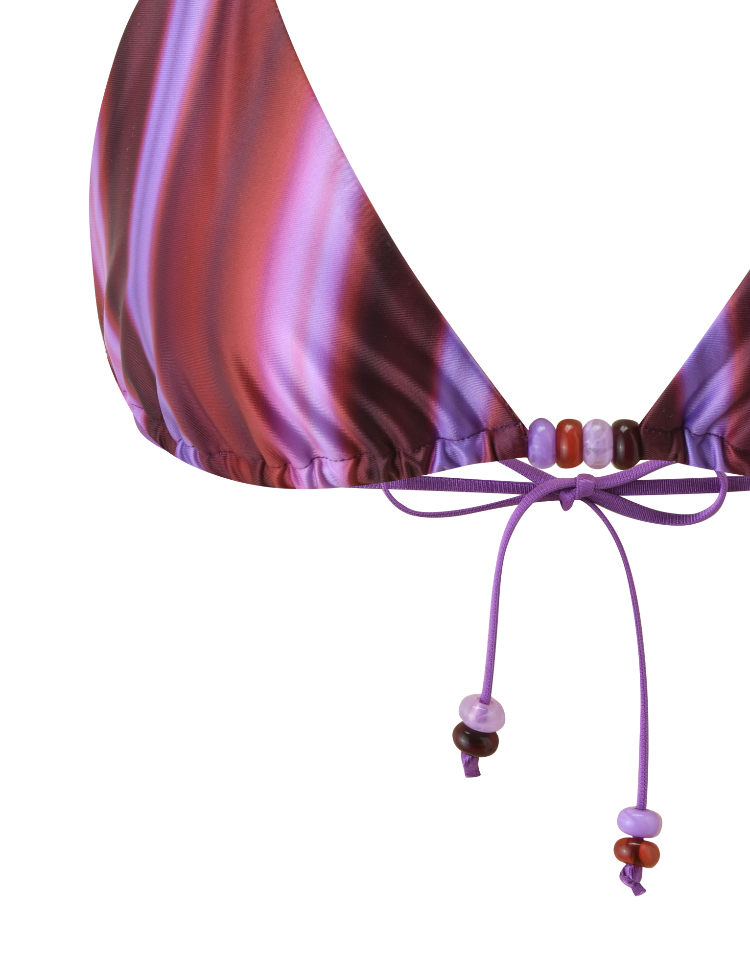 Close-up of the TIGERMIST FINLEA BIKINI TOP - DUSK OMBRE STRIPE, an adjustable triangle top with purple and pink stripes, featuring purple string ties detailed with small purple and red beads.