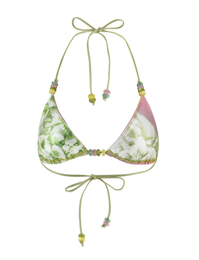 The FINLEA BIKINI TOP - GREEN : FLORAL : STRIPE by TIGERMIST showcases a green and pink floral pattern on a triangle design. The halter is tied with delicate green straps adorned with multicolored beads, and the adjustable band around the chest fastens with matching strings and beads. This tropical print bikini bottom is completed with thin straps embellished with beads.