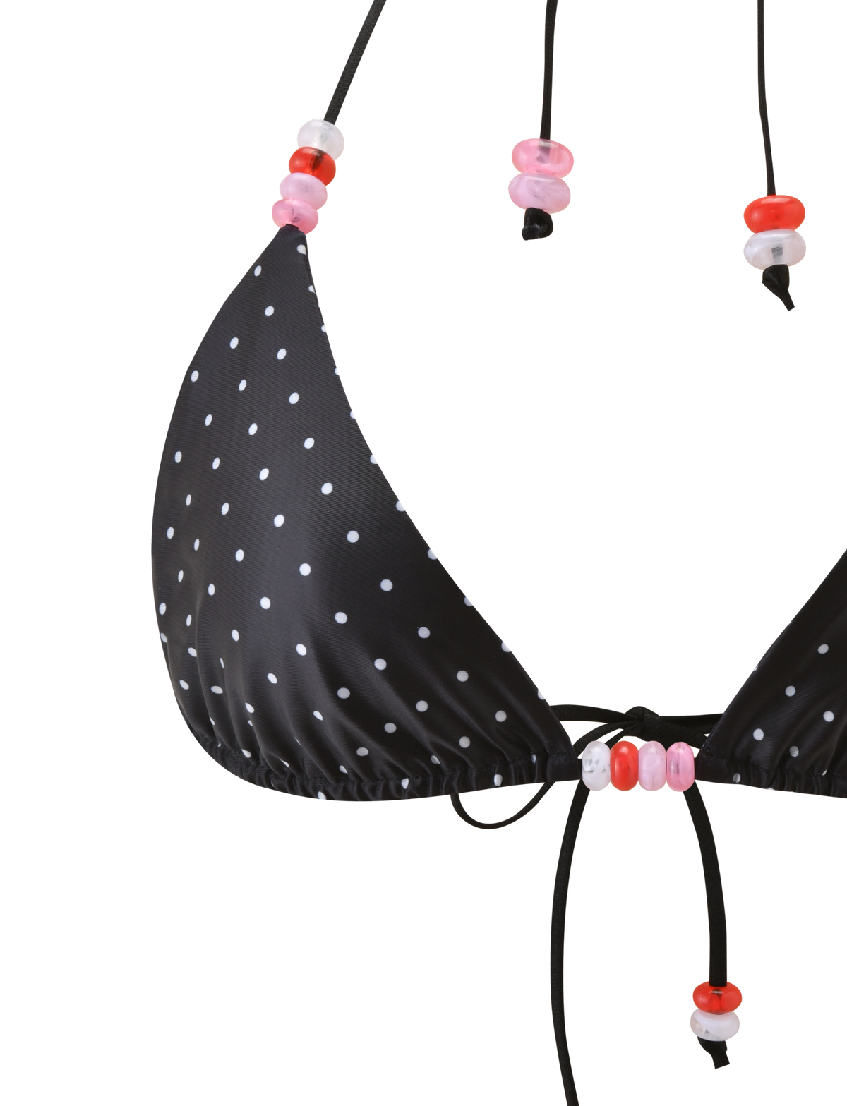 Close-up of the TIGERMIST FINLEA BIKINI TOP - POLKA DOT BLACK CREAM, featuring black fabric with cream polka dots and pink and red bead accents on the halter straps, set against a white background.